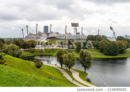 Munich, Germany - Oct 03, 2024: Stadium of the Olympiapark in Munich, Germany, constructed for the 1972 Summer Olympics Munich, Germany - Oct 03, 2024: Stadium of the Olympiapark in Munich, Germany, constructed for the 1972 Summer Olympics 124690081