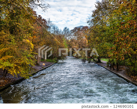 Munich, Germany - Oct 29, 2024: Golden autumn view in famous Munich relax place - Englischer Garten. Munich, Bavaria, Germany Munich, Germany - Oct 29, 2024: Golden autumn view in famous Munich relax place - Englischer Garten. Munich, Bavaria, Germany 124690101