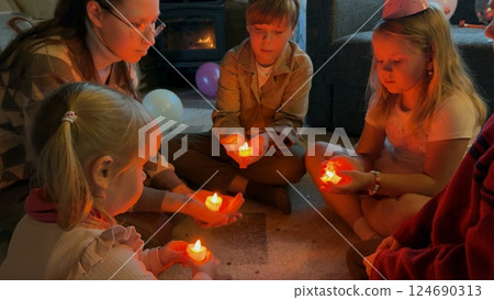 Children hold glowing hearts in their hands 124690313