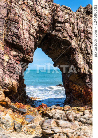 Pedra Furada. Famous touristic attraction on the beach of Jericoacoara, Ceara State, Brazil. 124690582