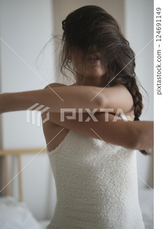 An Elegant and Captivating Portrait of a Woman Dressed in an Exquisite Lace Dress 124691149