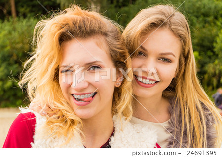 Two fashionable women outdoor Two fashionable women outdoor 124691395