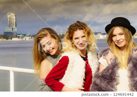 Positive female friends having fun outdoor 124691442