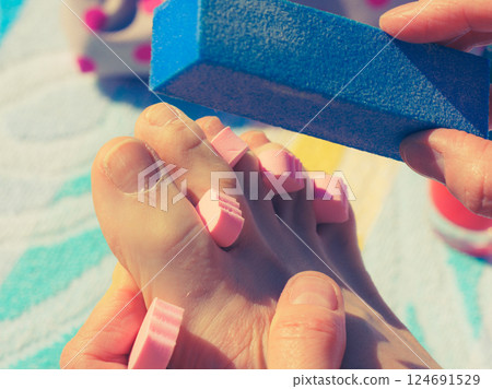 Woman pedicure outdoor 124691529