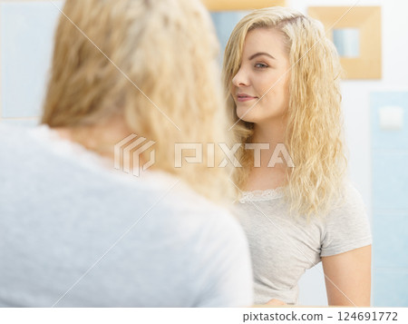 Woman with wet blonde hair Woman with wet blonde hair 124691772