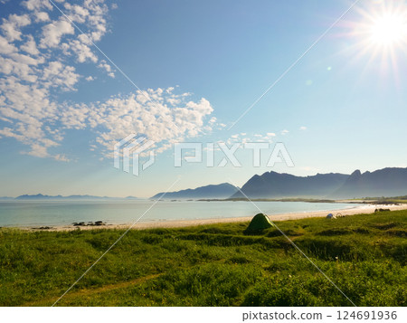 Seascape with tent on beach, Lofoten Norway Seascape with tent on beach, Lofoten Norway 124691936
