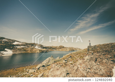 Tourist taking photo in norwegian nature 124692040