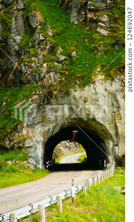 Road with old tunnel in mountains Norway 124692047
