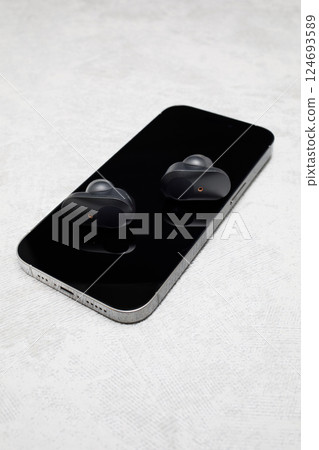 Earphones and smartphone 124693589