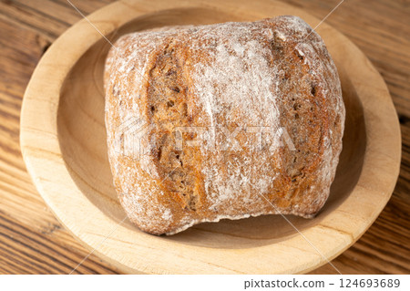 Brown rye bun, square gluten free bread, whole grain healthy breakfast bread Brown rye bun, square gluten free bread, whole grain healthy breakfast bread 124693689