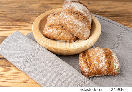 Brown rye bun, square gluten free bread, whole grain healthy breakfast bread Brown rye bun, square gluten free bread, whole grain healthy breakfast bread 124693691