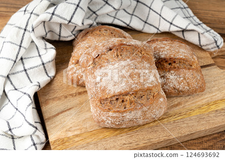 Brown rye bun, square gluten free bread, whole grain healthy breakfast bread 124693692