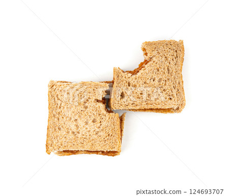 Bitten dried pate sandwich isolated, low-quality food leftovers, bad quality toast bread lunch Bitten dried pate sandwich isolated, low-quality food leftovers, bad quality toast bread lunch 124693707