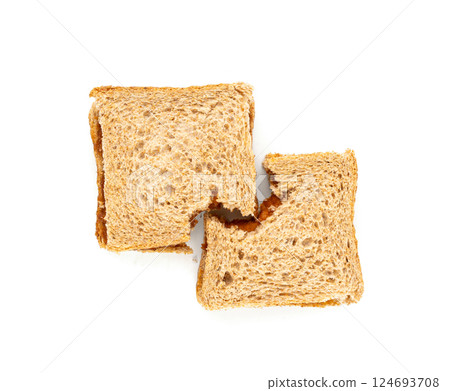 Bitten dried pate sandwich isolated, low-quality food leftovers, bad quality toast bread lunch Bitten dried pate sandwich isolated, low-quality food leftovers, bad quality toast bread lunch 124693708