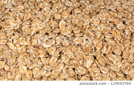 Spelt flakes isolated, dry raw rolled flat oat grains, wheat, oatmeal or bran, barley rye cereals Spelt flakes isolated, dry raw rolled flat oat grains, wheat, oatmeal or bran, barley rye cereals 124693769