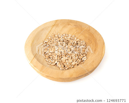 Spelt flakes isolated, dry raw rolled flat oat grains, wheat, oatmeal or bran, barley rye cereals Spelt flakes isolated, dry raw rolled flat oat grains, wheat, oatmeal or bran, barley rye cereals 124693771