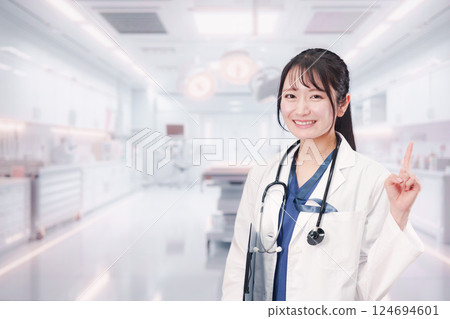 Young female doctor working at hospital 124694601