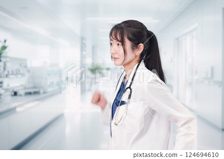 Young female doctor working at hospital 124694610