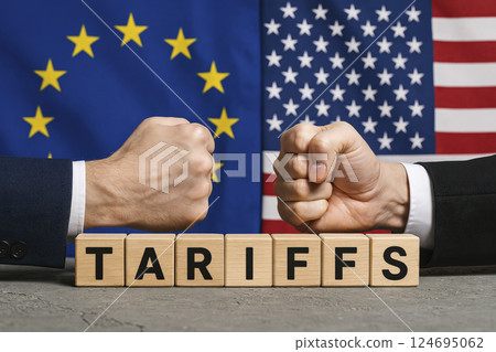 USA vs EU trade conflict concept with fists and tariffs blocks. AI generated 124695062