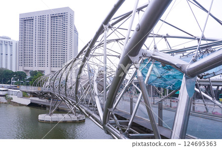 Helix Bridge that links the Marina Center and Bayfront areas. iconic bridge in Singapore Helix Bridge that links the Marina Center and Bayfront areas. iconic bridge in Singapore 124695363