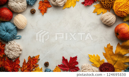 Top view of autumn composition with thread balls and beautiful leaves on light beige concrete background. 124695830