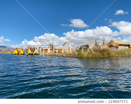 Titicaca lake, Idyllic life Uros Floating Island, Peru, South America Titicaca lake, Idyllic life Uros Floating Island, Peru, South America 124697371