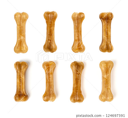 Rawhide bones, collagen dog chew food, pressed dry kibble, natural long-lasting canine treats Rawhide bones, collagen dog chew food, pressed dry kibble, natural long-lasting canine treats 124697391
