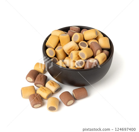 Filled dog biscuits, crackers isolated, soft crunchy pet treats pile, flavored small canine cookie Filled dog biscuits, crackers isolated, soft crunchy pet treats pile, flavored small canine cookie 124697400
