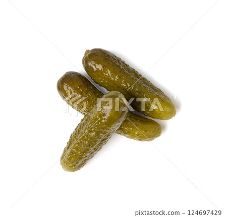 Gherkins isolated, pickled small cucumbers, tiny fermented food, little marinated canned vegetables Gherkins isolated, pickled small cucumbers, tiny fermented food, little marinated canned vegetables 124697429