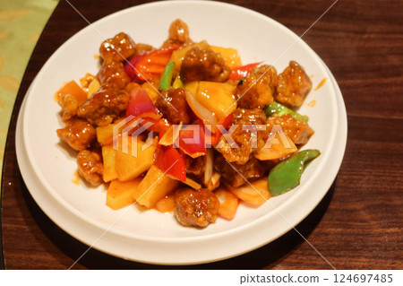 close up of Chinese stir fried green beans in Sichuan style with minced pork, garlic, spice and green beans on a white plate close up of Chinese stir fried green beans in Sichuan style with minced pork, garlic, spice and green beans on a white plate 124697485