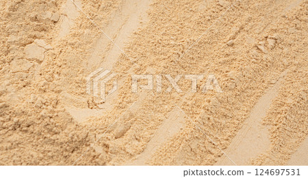 Maca powder texture background, dry Peruvian ginseng powder pattern, ground ayak willku 124697531