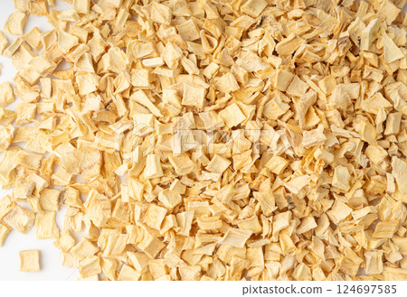 Dry parsley root texture background, dried diced celery cubes pattern, small liquorice pileces banner 124697585