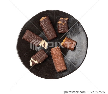 Protein bar isolated, chocolate energy paleo snack, healthy cereal nutrition with nuts, fruits, muesli Protein bar isolated, chocolate energy paleo snack, healthy cereal nutrition with nuts, fruits, muesli 124697597