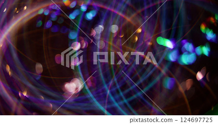 Festive circles. Defocused glimmering flickers. Colorful gleaming purple particles lens flare motion on abstract bokeh light blurred modern background. Festive circles. Defocused glimmering flickers. Colorful gleaming purple particles lens flare motion on abstract bokeh light blurred modern background. 124697725