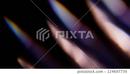 Blur glare. Rainbow background. Defocused blue yellow green colorful illuminated spectrum sparkle light on abstract optical art. 124697739