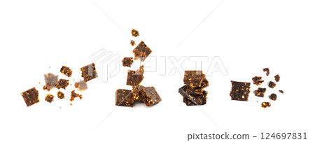 Falling Cocoa Chia Paleo Bar Isolated, Flying Crumbled Energy Snack with Nuts, Muesli Falling Cocoa Chia Paleo Bar Isolated, Flying Crumbled Energy Snack with Nuts, Muesli 124697831