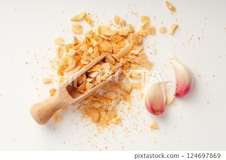 Dry Garlic Slices, Crispy Fried Cloves Pile Closeup, Roasted Grilled Garlic Flakes, Clove Chip Group Dry Garlic Slices, Crispy Fried Cloves Pile Closeup, Roasted Grilled Garlic Flakes, Clove Chip Group 124697869