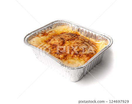 Lasagna portion in aluminium foil tray isolated. Oven baked lasagne for heating, container, airplane food Lasagna portion in aluminium foil tray isolated. Oven baked lasagne for heating, container, airplane food 124697929