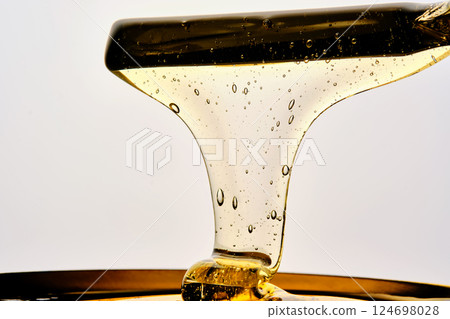 Photo of a sugar paste for depilation hair removal procedure. Texture. 124698028