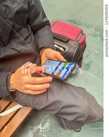 Traveler Using Smartphone While Waiting, Digital Communication, Modern Journey. High quality photo 124698069