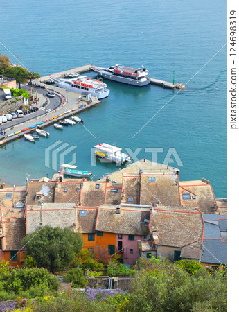 Yachts, boats in bay of Porto Venere, Liguria. Sea and tourism in Italy. Traditional buildings. Background for design. 124698319