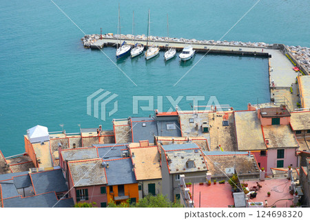 Yachts, boats in bay of Porto Venere, Liguria. Sea and tourism in Italy. Traditional buildings. Background for design. Yachts, boats in bay of Porto Venere, Liguria. Sea and tourism in Italy. Traditional buildings. Background for design. 124698320