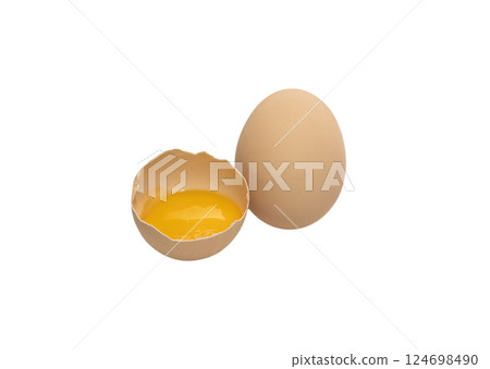 Light brown organic raw chicken egg with yolk isolated on white background. Light brown organic raw chicken egg with yolk isolated on white background. 124698490