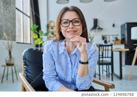 Web portrait of middle-aged business woman in home office 124698788