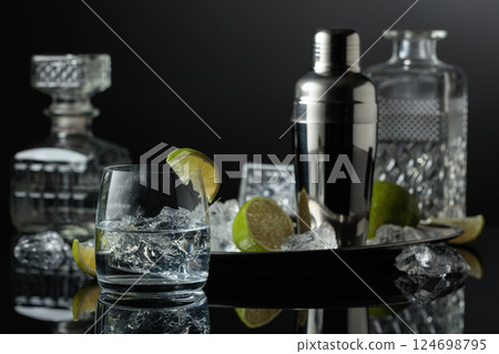 Vodka or gin in a glass with ice. 124698795