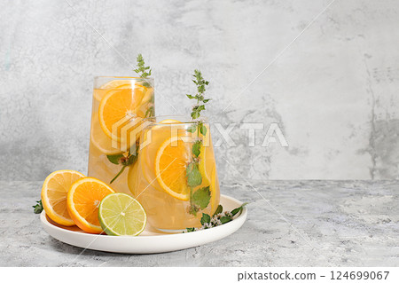 Diet vegan cocktail with citrus, detox water, mojito with lemon, lime, orange, mint and green apple. Detox diet and weight loss concept, healthy lifestyle advertising, menu for cafe and restaurant. 124699067
