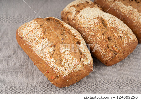 Whole wheat brown bread, fitness pumpkin carrot buns with seeds, cereal bread grain bun 124699256