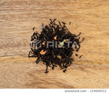 Flavored Black Tea Leaves Pile Texture, High Quality Black Tea Pile with Fruits and Flowers, Dry Tea Leaves 124699312