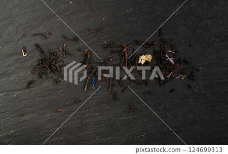 Flavored Black Tea Leaves Pile Texture, High Quality Black Tea Pile with Fruits and Flowers, Dry Tea Leaves Flavored Black Tea Leaves Pile Texture, High Quality Black Tea Pile with Fruits and Flowers, Dry Tea Leaves 124699313