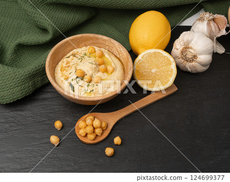Hummus in bowl, houmous dip, chickpea humus tahini sauce, middle eastern spread 124699377